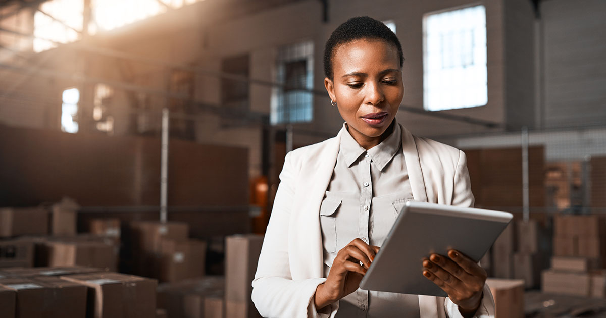 https://startupsavant.comA woman working in a warehouse on a tablet. 