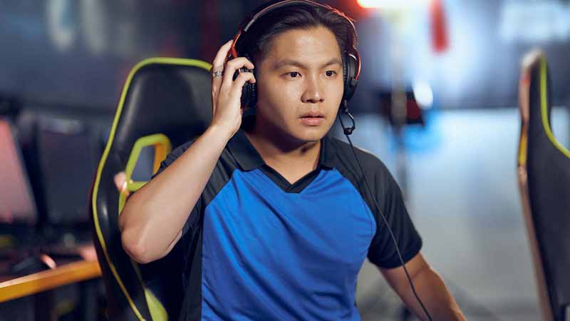 Man using a headset to play video games.