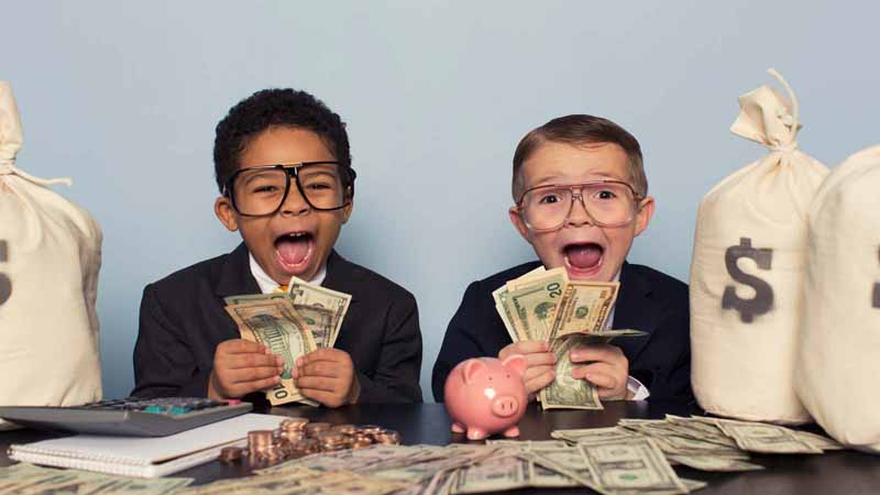 Children in business suits holding lots of money.