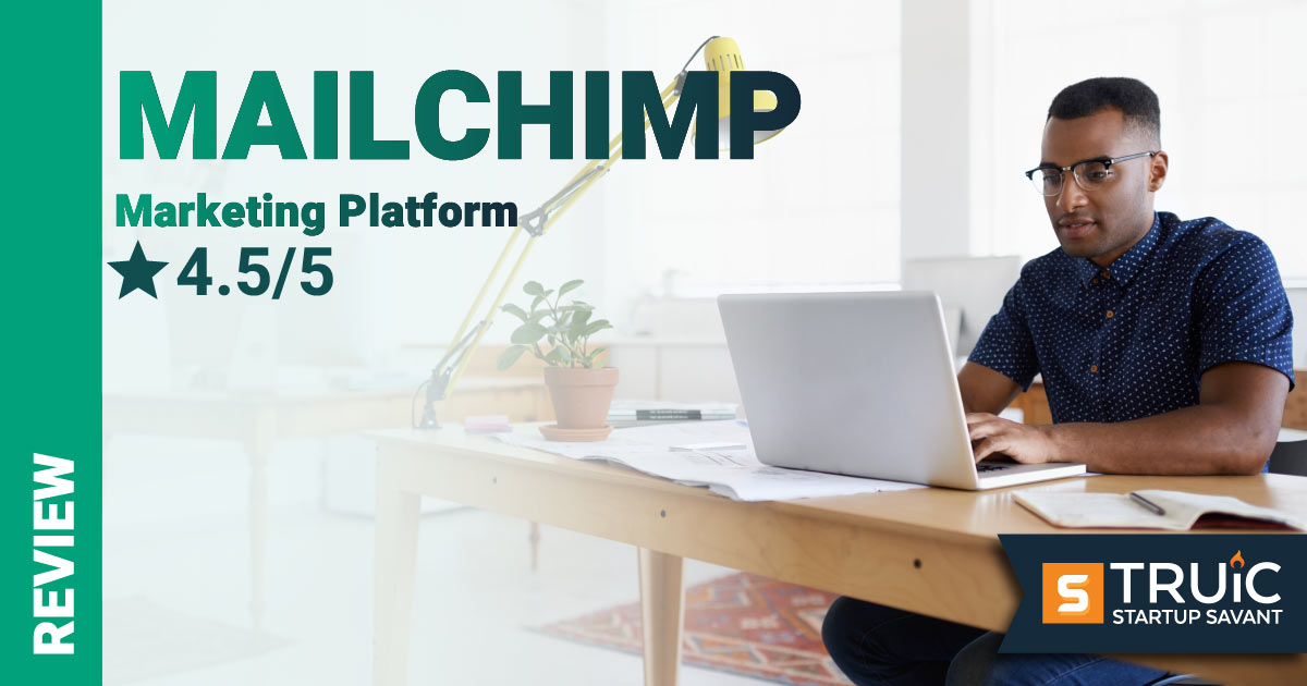 Man at desk on laptop with Mailchimp rating on the left.