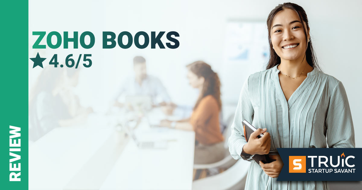 Woman smiling, holding a notebook with text Zoho Books Review.