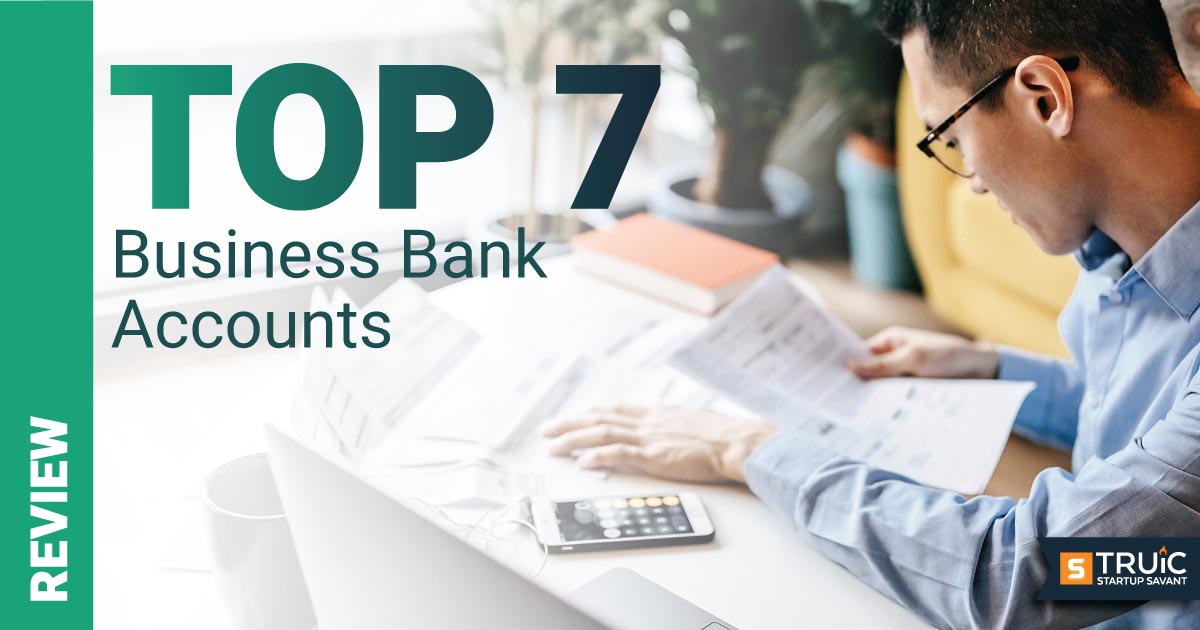 https://startupsavant.comA person using calculator with text; Top 7 Business Bank Accounts
