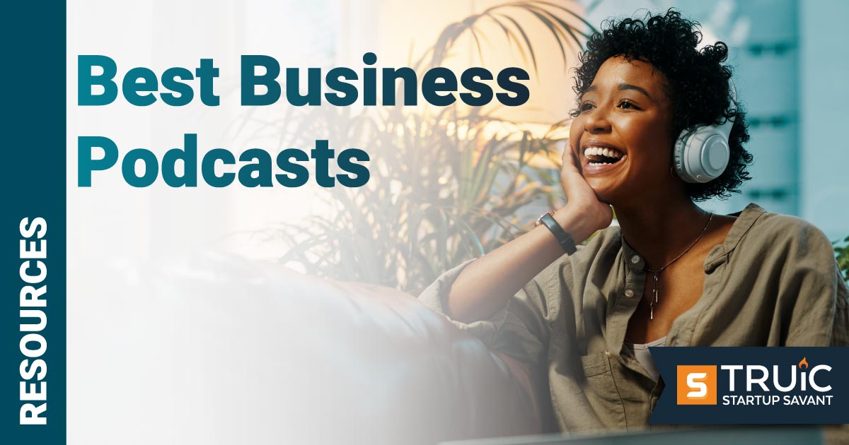 Woman smiling and laughing while listening to a podcast with text Best Business Podcasts.