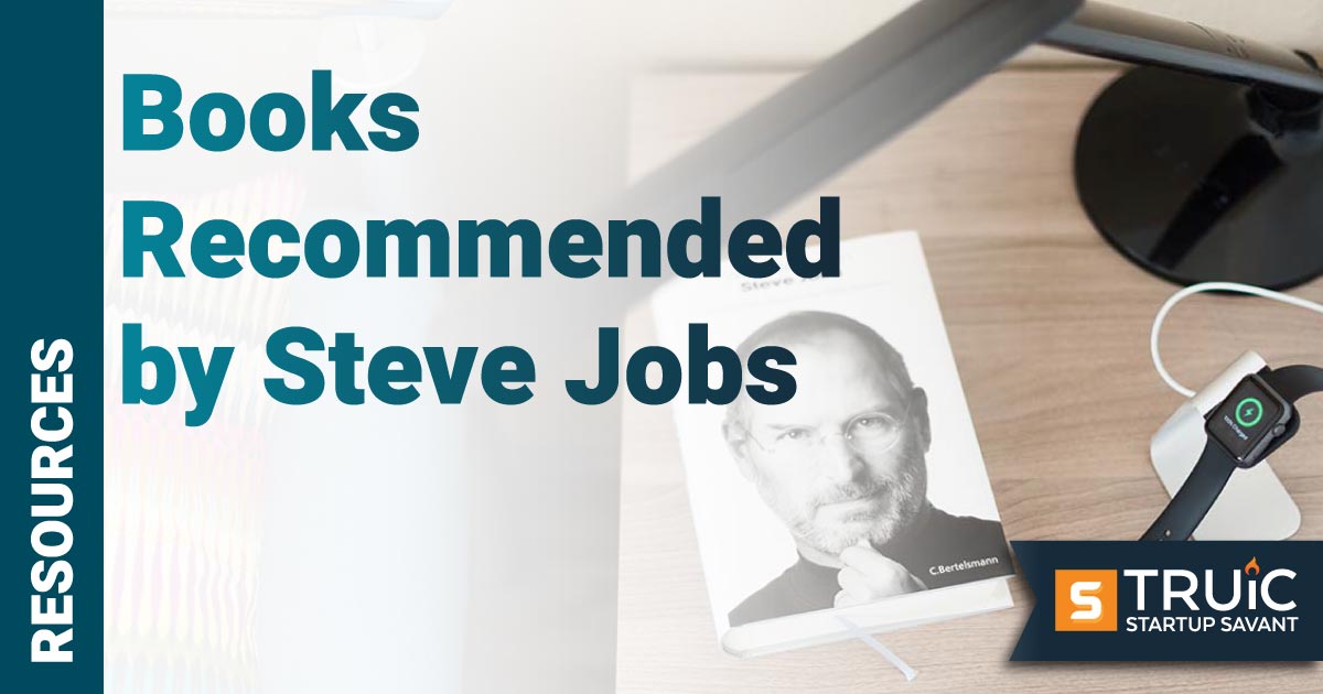 Book with Steve Jobs on the cover on a nightstand.