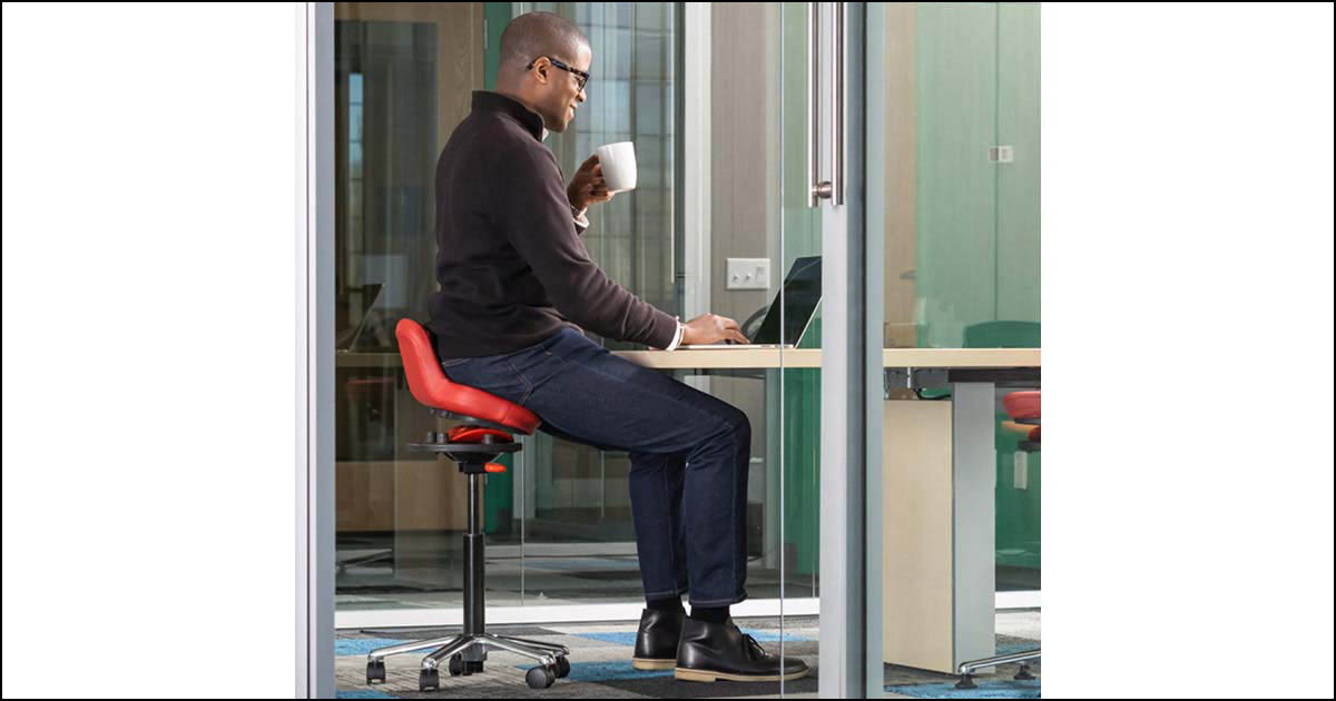Man sitting on QOR360 office chair.