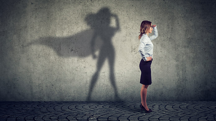 Female entrepreneur with superwoman shadow