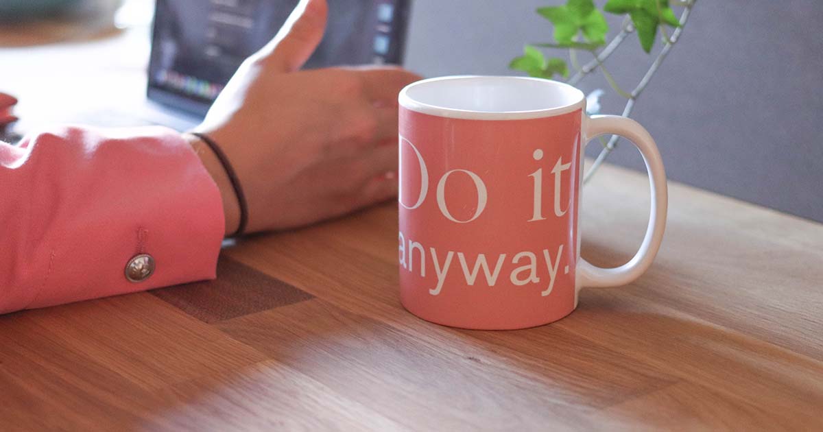Pink mug that says, "Do it anyway."
